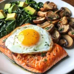 Pan-Seared Salmon with Sunny Egg, Sautéed Spinach, Mushrooms & Avocado